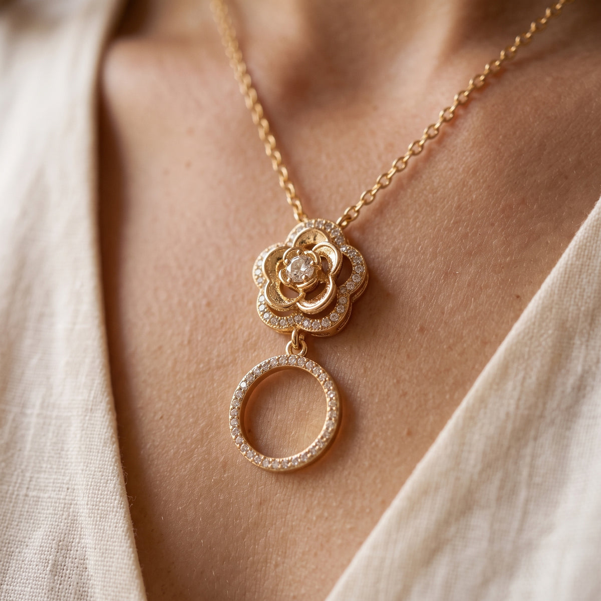 Rose pendant gold necklace with crystal rose and pave circle drop, worn close-up