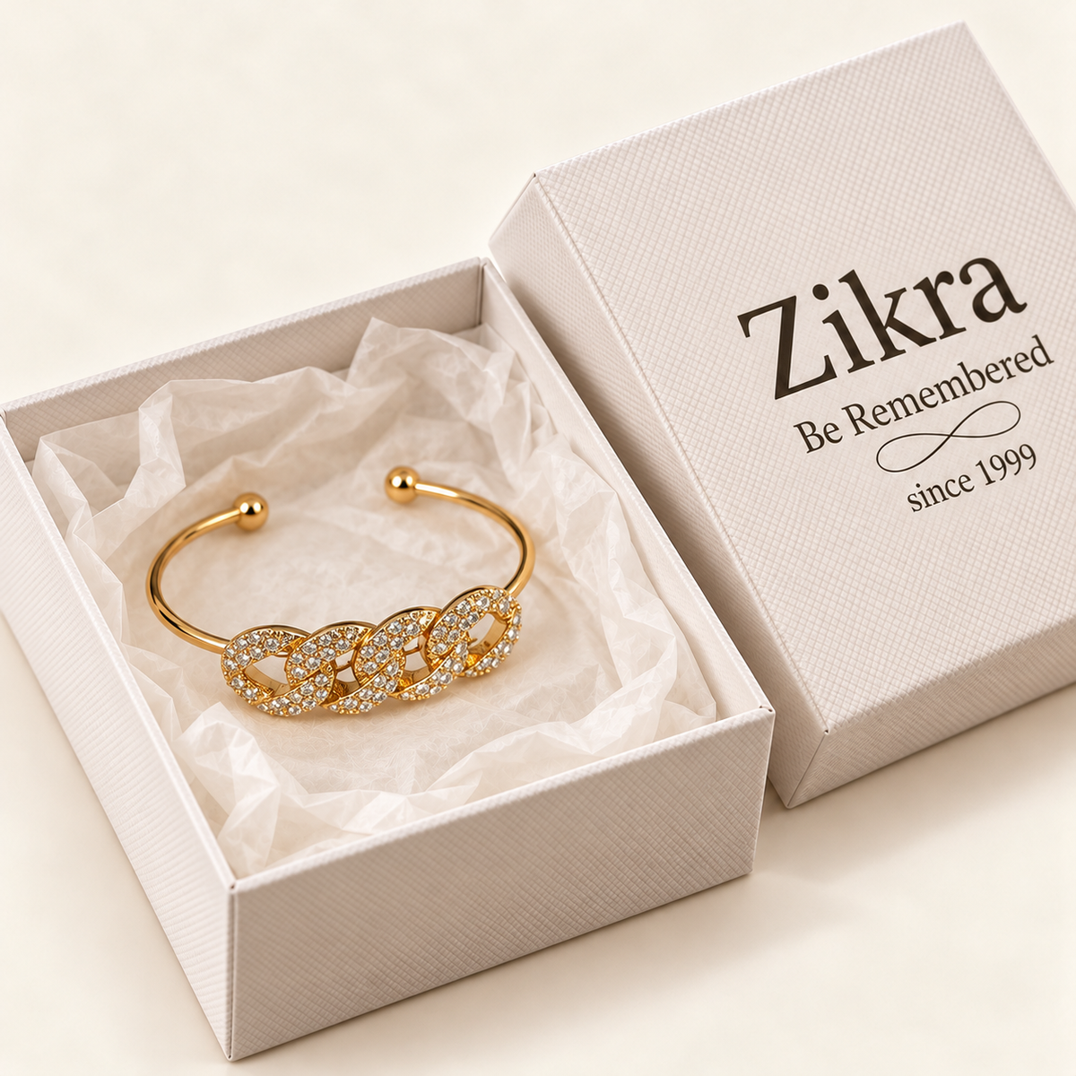Celeste pave link gold cuff bracelet in an open Zikra gift box