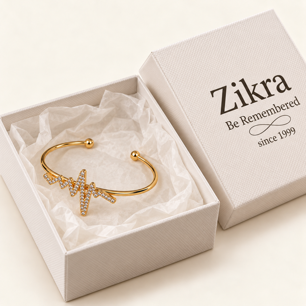 Heartbeat gold cuff bracelet with sparkling heartbeat charm in a Zikra gift box